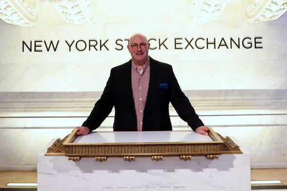 Chris Johnson at the New York Stock Exchange podium - November 2023
